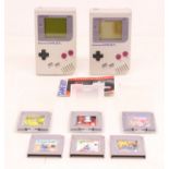 Game Boy: A pair of original Nintendo, Game Boy handheld consoles, Reference DMG-001. Together