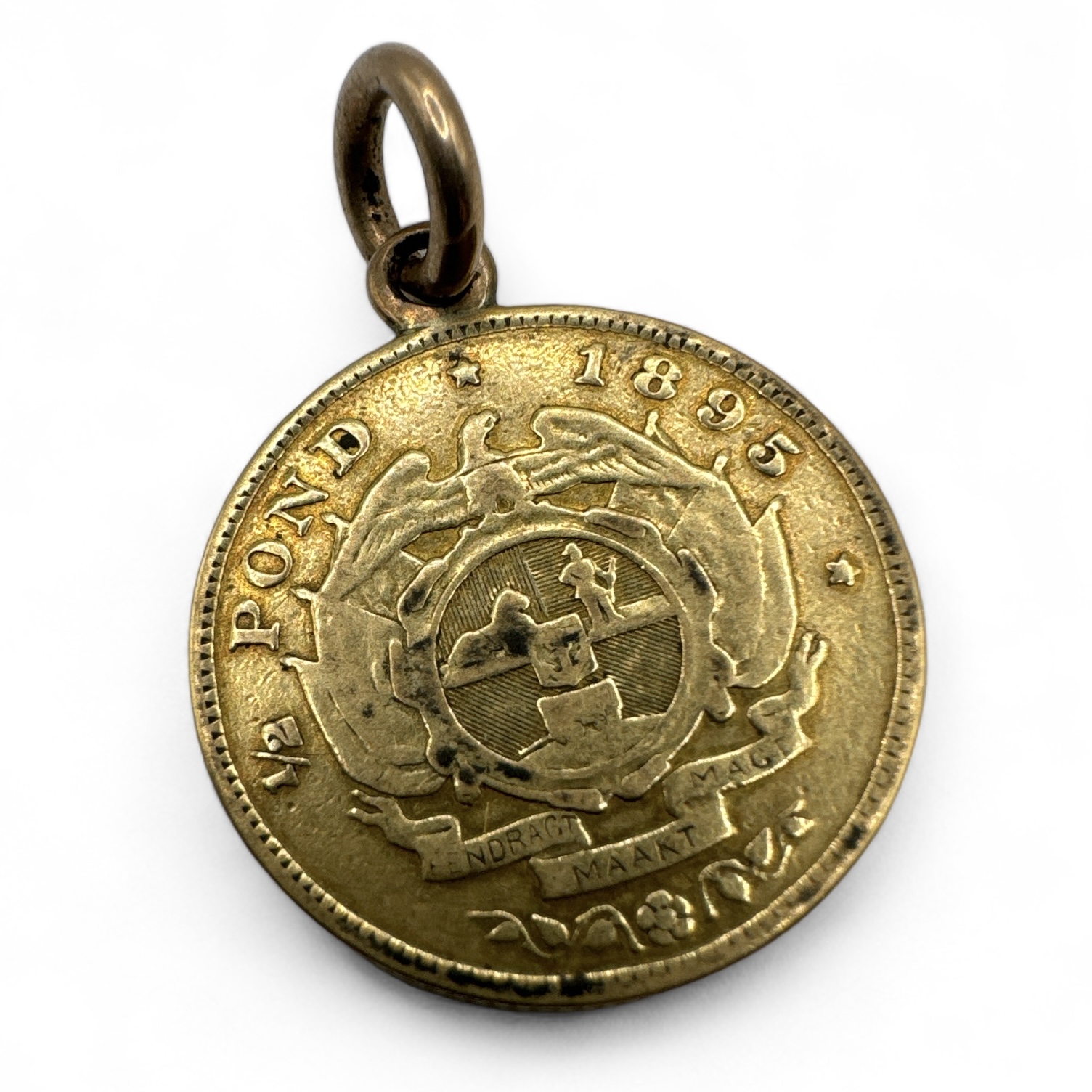 An 1895 gold 1/2 pond coin with a soldered ring mount. Gross weight approximately 4.28 grams.