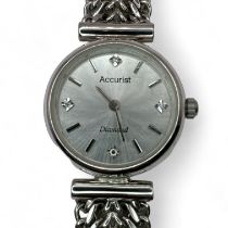 A ladies 9ct white gold Accurist quartz cocktail watch. Featuring a silvered dial with silver and