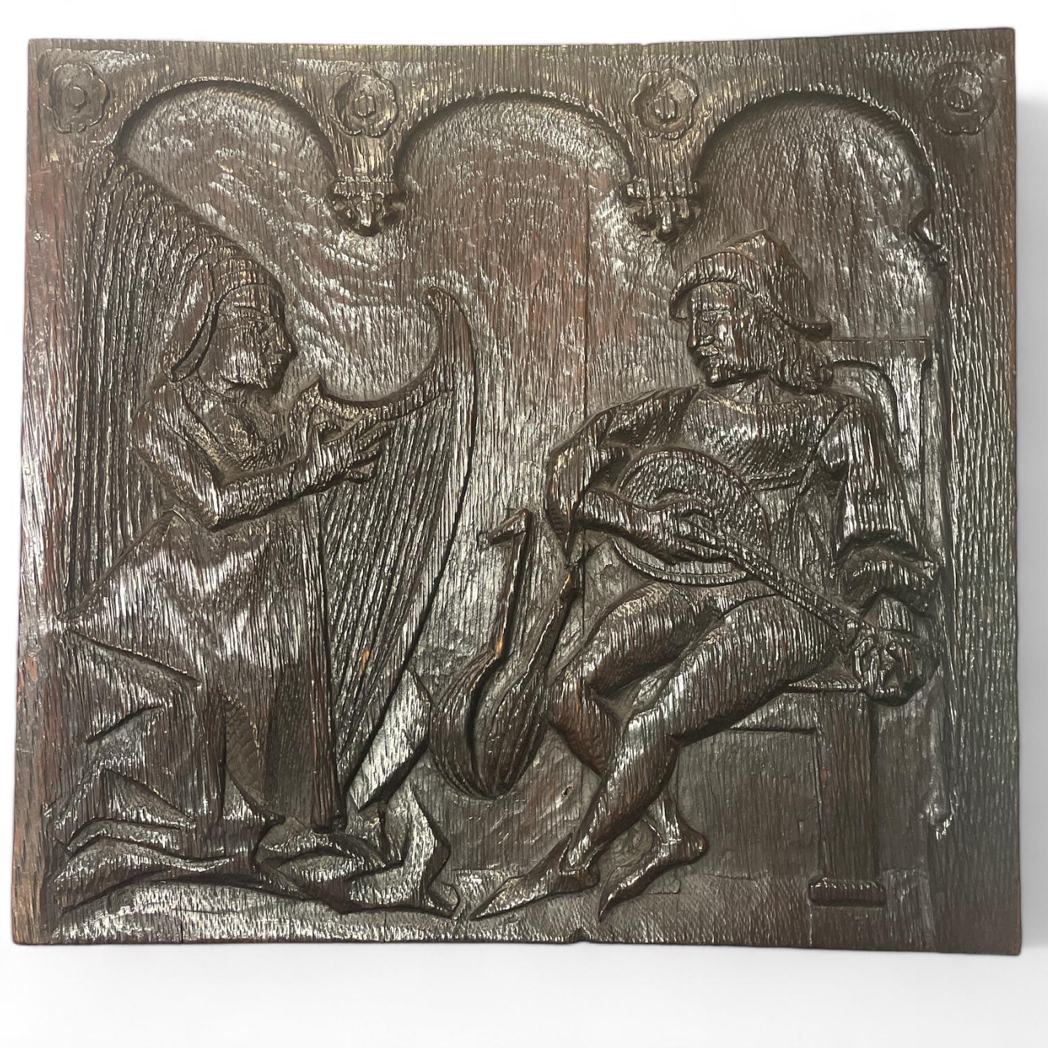 An antique carved oak panel. lady playing the harp and a man playing a lute 34cm x 2cm x 32cm