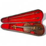 An antique violin with carved lion head scroll. Approximately 14 inch single piece back. No label