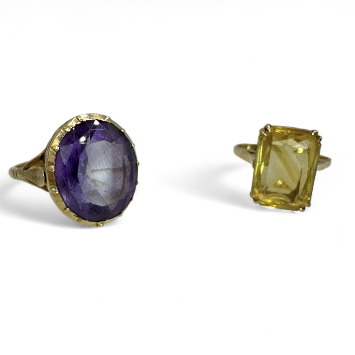 Two gem set cocktail rings - one in 9ct gold, the other stamped "15ct". The 9ct gold ring is set