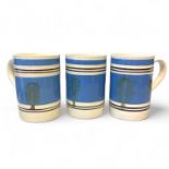 Three large Mochaware slip decorated earthenware tankards featuring a tree 'dendritic' pattern. On a