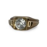 A white sapphire set yellow metal ring, testing as 9ct gold.  Size M. Gross weight approximately 4.