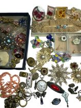 A collection of costume jewellery to include 65 brooches (including a Ruskin style pewter Arts &