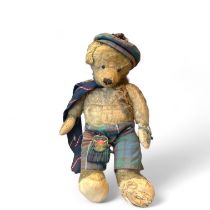 A vintage mohair teddy bear with boot button eyes dressed in Scottish Attire  54cm tall  and in play