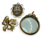 A 9ct yellow gold cameo brooch, depicting the three graces, along with a "9ct" stamped open locket
