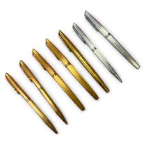 A collection of Waterman pens in silver and gold plate. Including two fountain pens with 18k gold