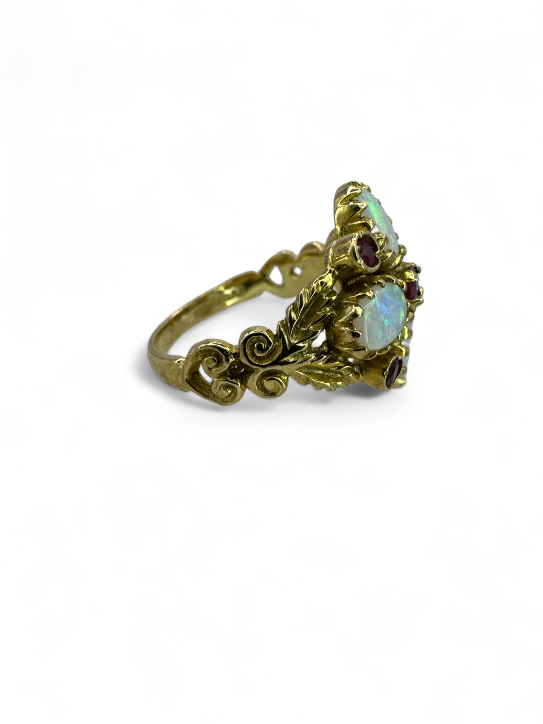 An opal and ruby set quatrefoil ring in 9ct yellow gold, with gold scroll work. Size N. Gross weight - Image 2 of 3
