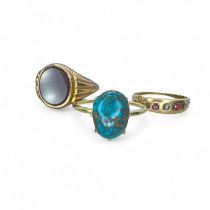 A matrix turquoise ring in precious yellow metal, testing as high grade gold, size O. Along with two