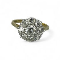 An 18ct gold diamond flower cluster ring, set with an estimated 1.3 carats of diamonds. Set with a