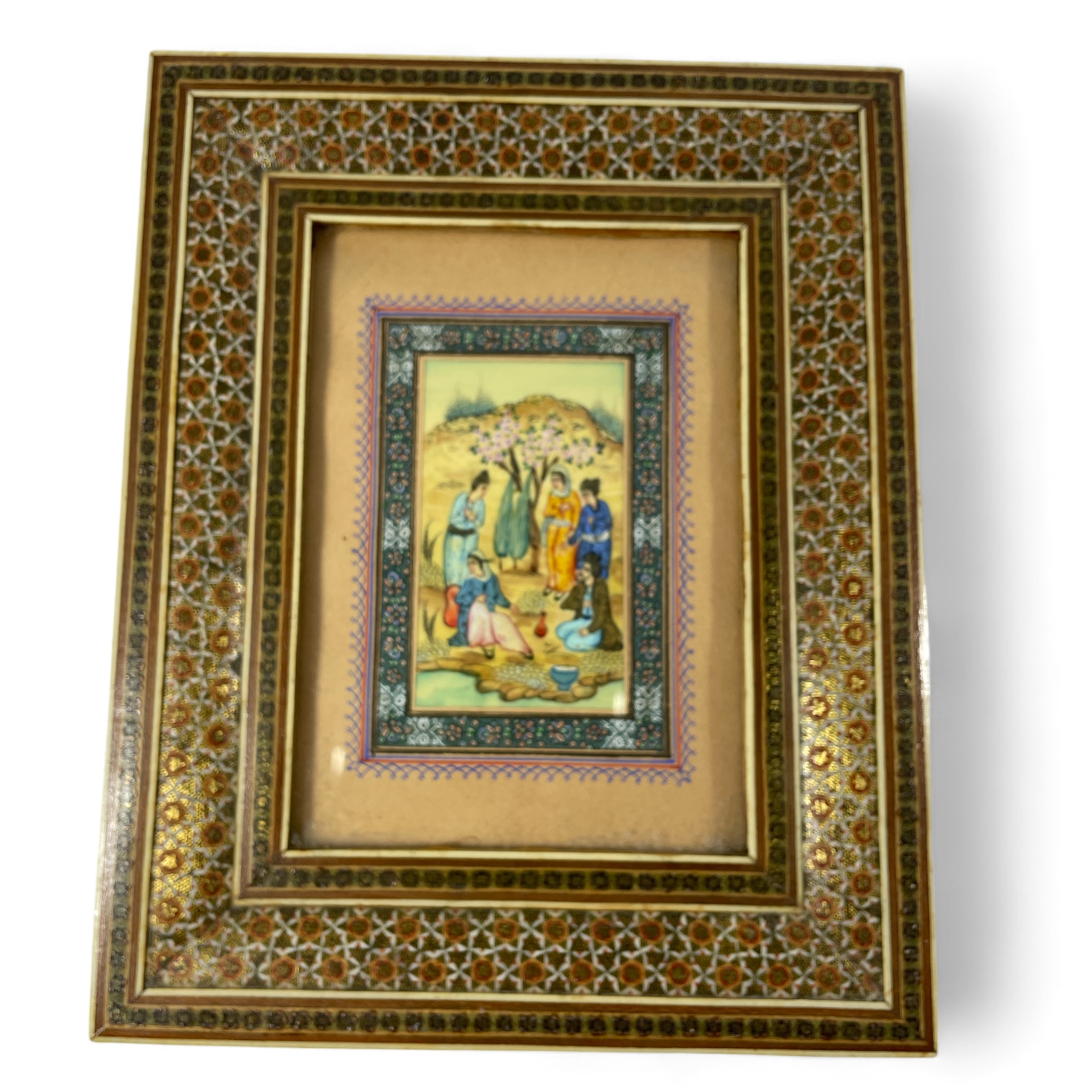 20th Century Persian Gouache Study.  Group of figures by a river in inlaid frame Frame measures