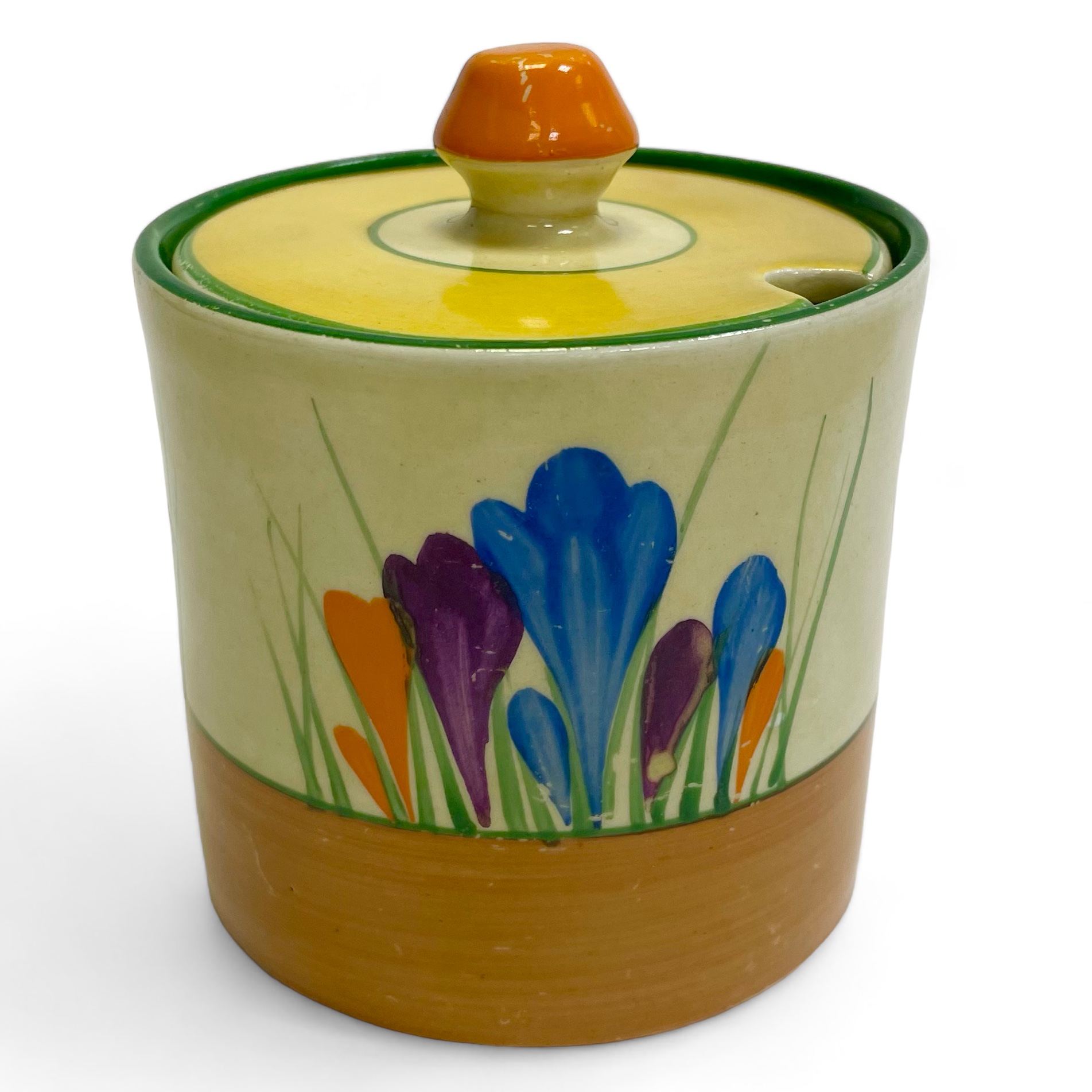 A Clarice Cliff Crocus pattern preserve pot. Approximately 9cm tall. 8cm diameter. Some scratches