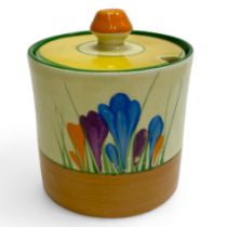 A Clarice Cliff Crocus pattern preserve pot. Approximately 9cm tall. 8cm diameter. Some scratches