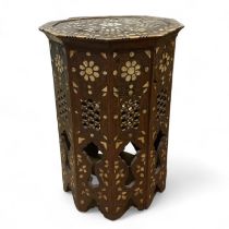 An Eastern Octagonal, side table with mother of pearl and bone inlay 39cm x 56cm Tall Some loss