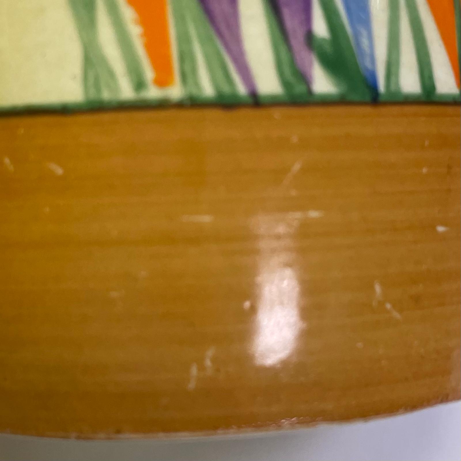 A Clarice Cliff Crocus pattern preserve pot. Approximately 9cm tall. 8cm diameter. Some scratches - Image 4 of 4