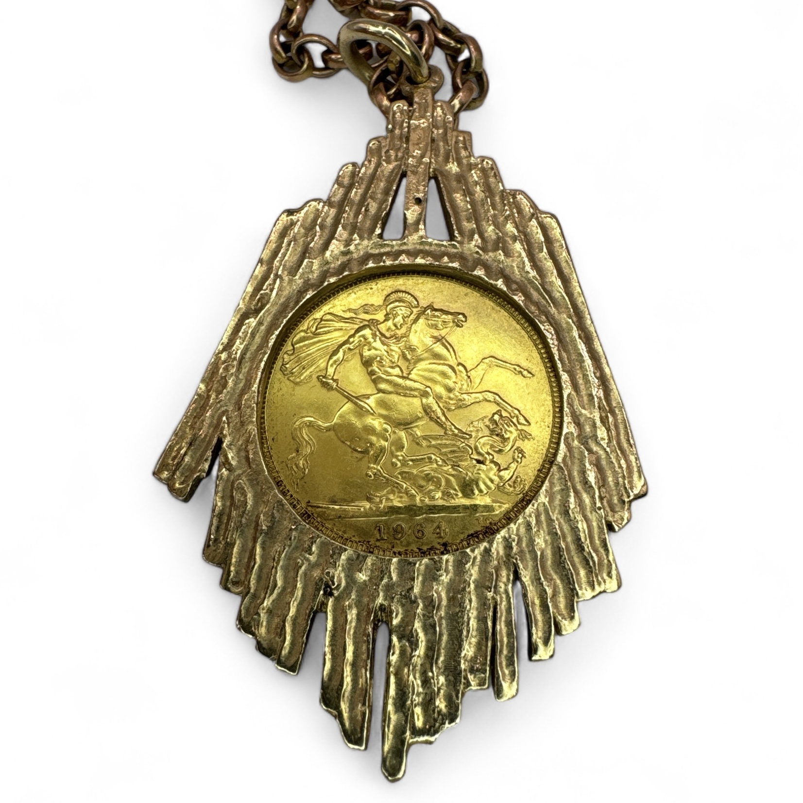 An Elizabeth II gold full Sovereign coin dated 1964 in a bark effect 9ct pendant mount on a gift - Image 2 of 2