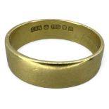 An 18ct yellow gold 5mm band ring. Size L. Approximate weight 3.50 grams.