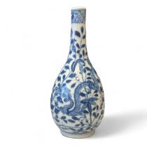 A Blue & White Oriental dragon bottle vase with four character mark to base. 9cm x 21cm tall Some