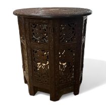 A carved hardwood Jerusalem side table. 44cm tall