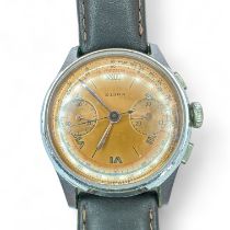 A 1950s gentleman's chronograph wrist watch, signed Elida. Featuring a rose metal coloured dial,