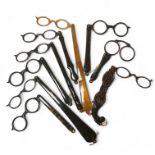 A collection of nine tortoiseshell lorgnettes, including an ornate double lorgnette.