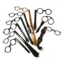 A collection of nine tortoiseshell lorgnettes, including an ornate double lorgnette.