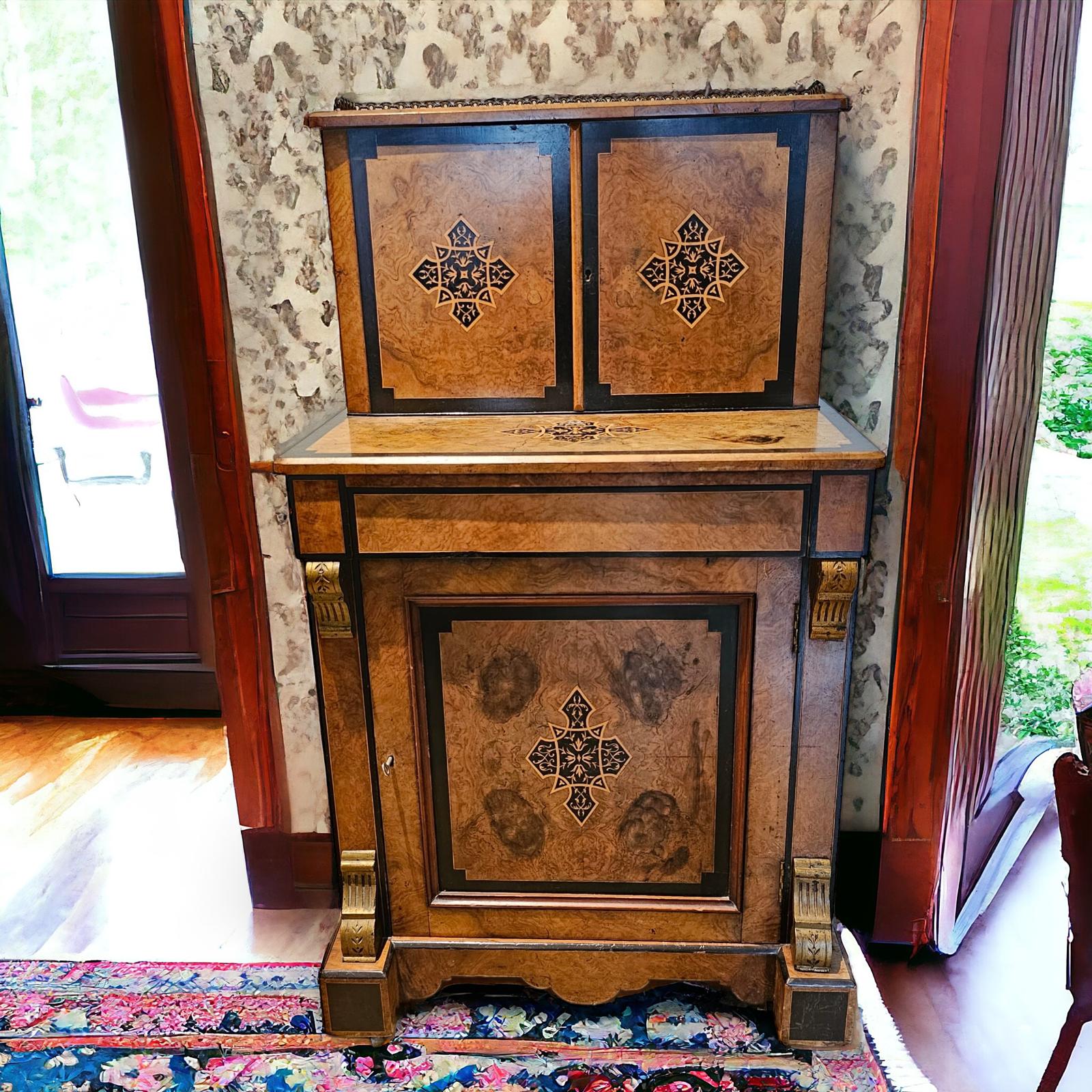 A Victorian Burr Walnut Ebonised Davenport with a fitted Upstand above a writing drawer and cupboard