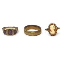 A collection of three 9ct gold rings. Comprising a 9ct gold edged court band ring, size Q1/2; a