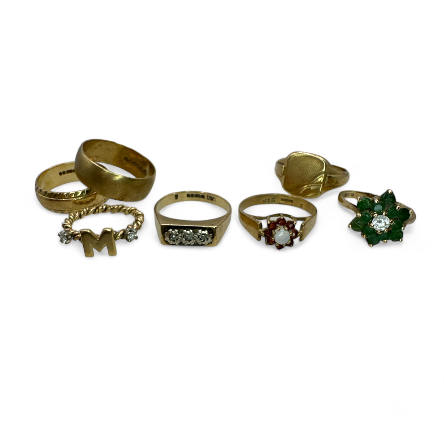 A group of seven 9ct gold rings.  To include hallmarked gold rings: two band rings, size O & M; a