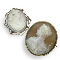 Two carved shell cameo brooches featuring classical Greek goddesses Hera and Psyche. Hera, wife of