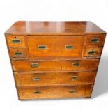 A 19th Century oak two section campaign secretaire chest, with a central secretaire drawer flanked