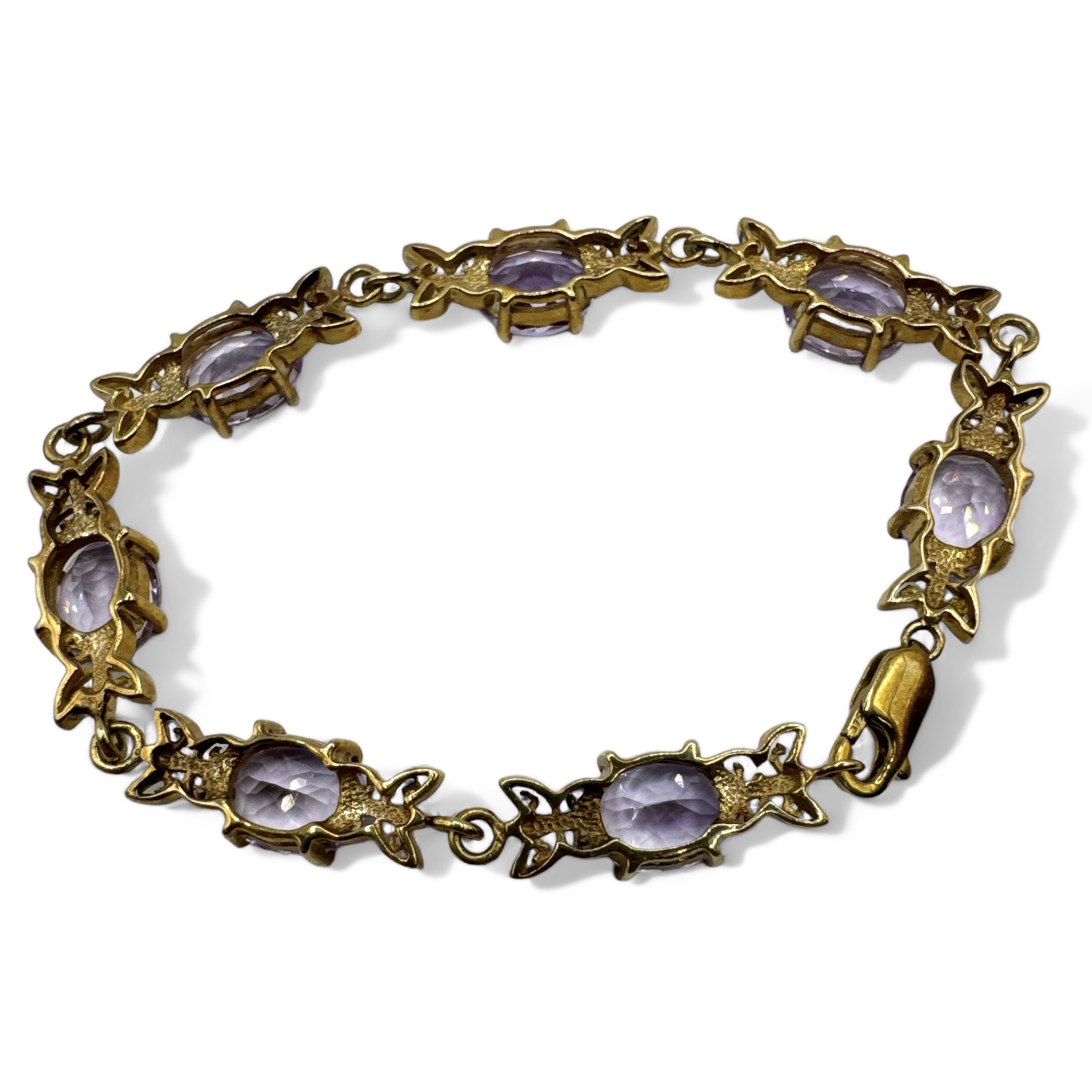 A 9ct Rose de France amethyst set gold bracelet, with foliate scroll work. With lobster clasp. - Image 2 of 3