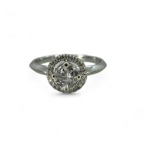 18ct white gold diamond ring, featuring a central solitaire effect invisible set group of four