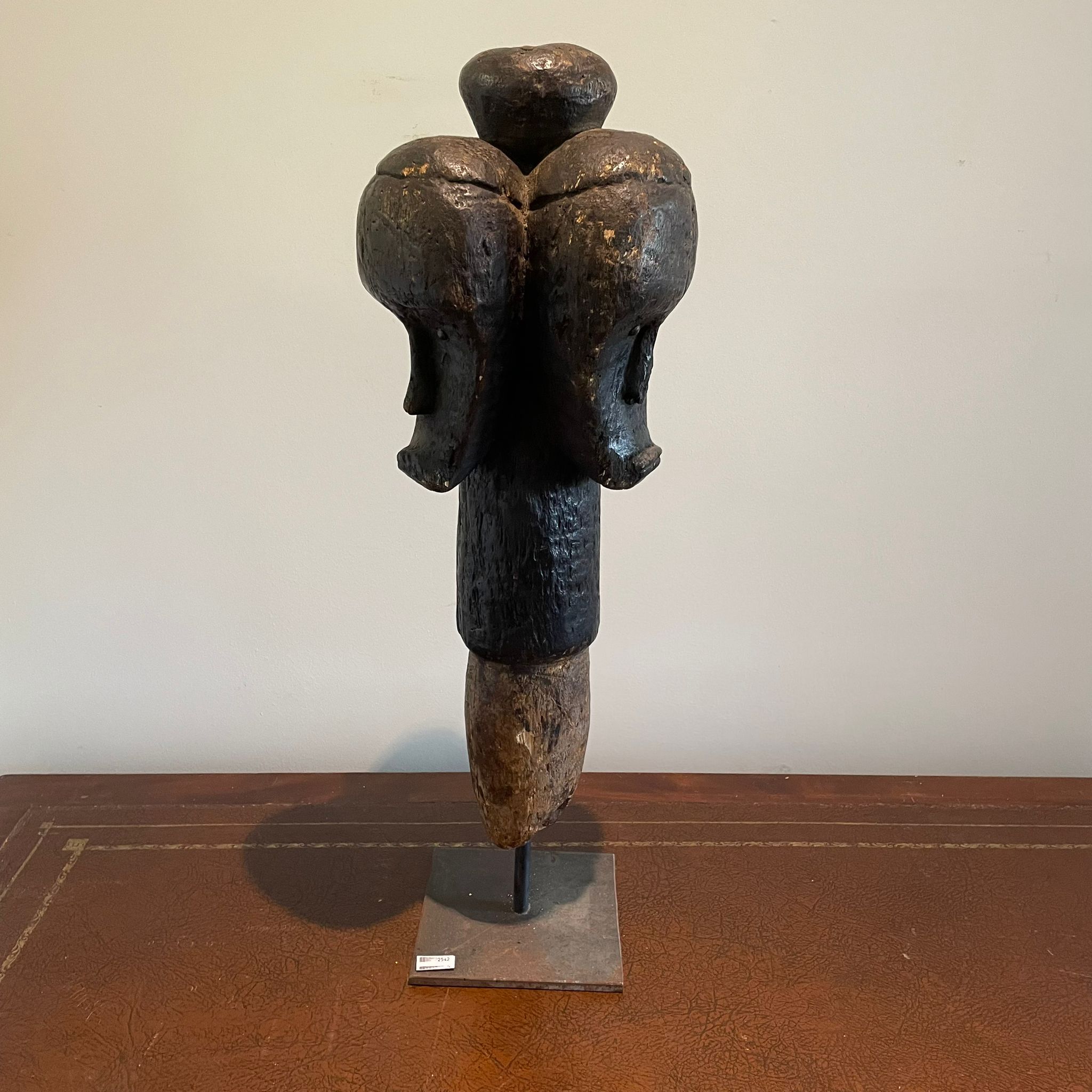 ***AWAY*** A carved African tribal three-headed marker approximately 19cm by 20cm by 62cm tall.