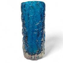 A Whitefriars Blue Glass Bark Vase. 8cm diameter x 19cm tall. Generally good with some scratches