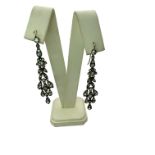 A pair of antique Belle Epoque style paste set drop earrings. Finely made in white metal with yellow