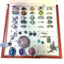 A collection of 925 silver jewellery comprising 27 rings, mostly gem set and including some gilded