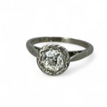 A diamond solitaire ring, illusion set with an old European cut diamond. Central diamond measuring