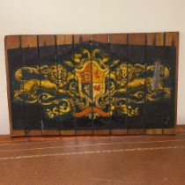 A 20th Century oil on panel armorial crest after a train wagon crest design. Approximately 60.5cm