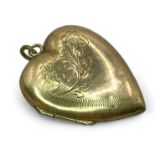An engraved heart shaped "9ct Back and front" locket. Gross weight approximately 4.00 grams.