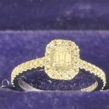 A Mappin and Webb platinum emerald cut diamond ring with GIA certificate. The principal stone is 0.