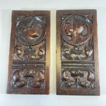 A pair of Carved Oak Panels with facing male and female heads 16cm x 2cm x 33cm  Good patina