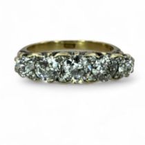 ***AWAY*** A Victorian style old European cut diamond half hoop ring. Set with five graduated