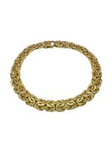 A 9ct yellow gold flat Byzantine chain bracelet. With lobster clasp. Approximate length 19cm.