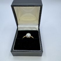 A diamond solitaire ring set with a calculated 0.80 carat round brilliant cut diamond. Set into a