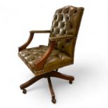 A green leather button back office chair, some small wear but a good colour and patina