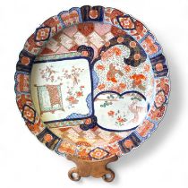 A large Japanese Imari Charger with lobbed rim and cartouche panels.  49cm diameter Firing crack