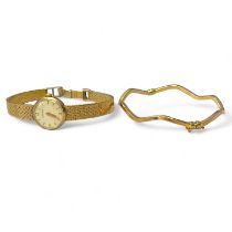 A 9ct yellow gold wave form bangle along with a 9ct yellow gold Rodania ladies cocktail watch on a