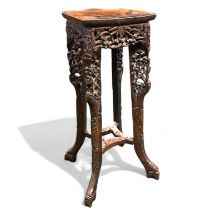 A carved Chinese hardwood Jardinière stand. Approximately 23.5cm x 24cm x 62cm tall. Some wear and